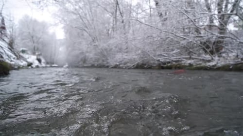 Water Flowing in Mountain Stream River in Cold Winter Nature Background