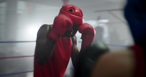 Boxing ring, punch and men in gym with fight, action and champion athlete training for competition