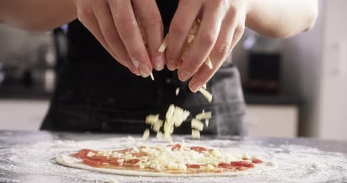 Person, hands and cheese on pizza for prepare raw ingredient for baking, production or process
