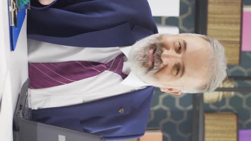 Professional Man Talks in Modern Office Setting