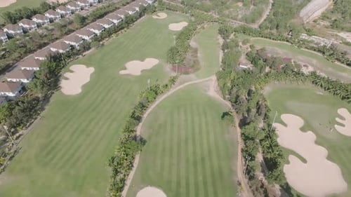 Aerial View of Golf Course and Villas on Sunny Day