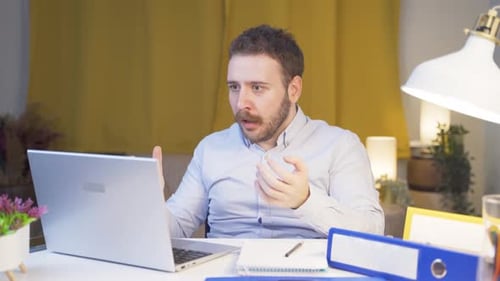 Home office worker man see his failure on laptop.