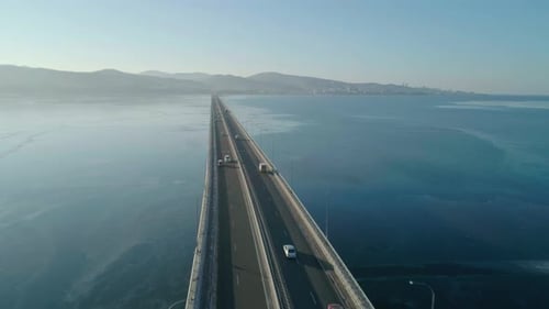 Aerial Drone View of Lowwater Bridge Across the Bay with Moving Car Active Movement of Transport