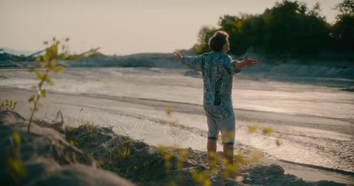 Man Reaching in Nature at Sunset