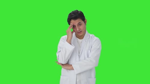 Stressed and tensed Indian scientist Green screen
