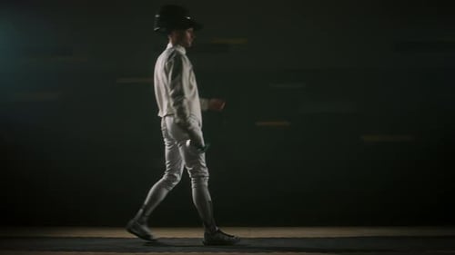 Male Fencer Getting Ready to Fight and Taking Starting Pose