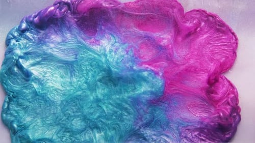Turquoise and Pink Viscous Liquid Flowing