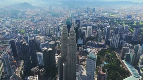 Petronas Twin Towers Dominating Kuala Lumpur Skyline with Vibrant KLCC Park