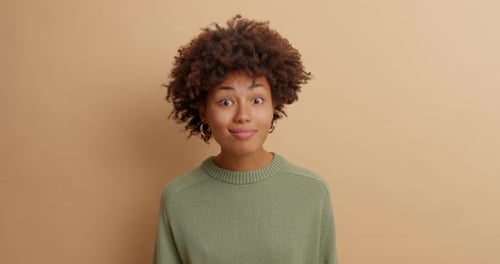 Woman Smiling and Looking at Camera in Studio