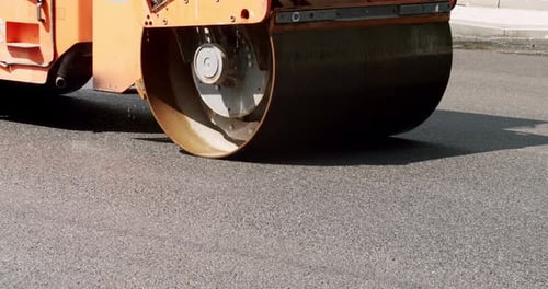 Asphalt Paver Machine on a Road Construction Site