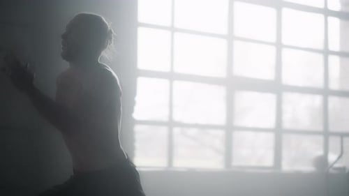 Male Athlete Doing Cardio Workout in Loft Building. Man Runner Running In