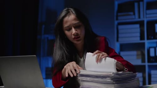 Businesswoman is seriously stressed working overtime bored and burnout due to office syndrome