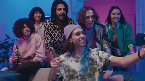 Male and Female Students Taking Group Selfie at Home Party