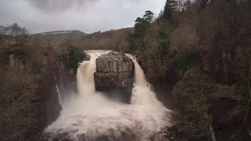 Aerial View of Powerful Waterfall in Natural Setting