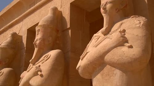 Sculptures of Pharaohs at the entrance on floor three of Hatshepsut's Funerary Temple in Luxor, Egyp