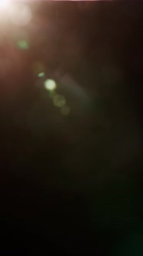 Sudden Flash Of Light And Trail Of Orbs In A Dark Expanse