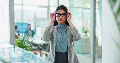 Arms crossed, glasses and face with business woman in office for corporate or professional career