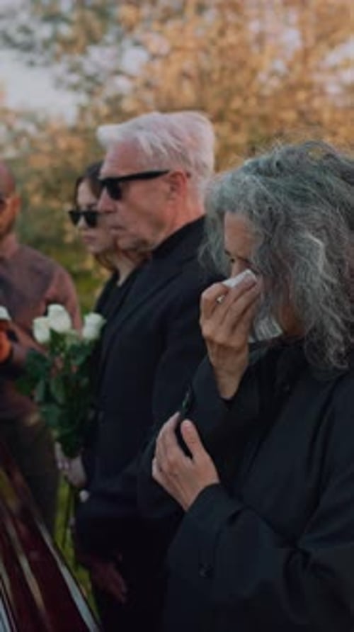 Crying Senior Lady at Funeral Service
