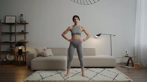 Woman Performs Neck Stretching Exercises at Home
