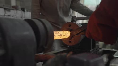 Ironworkers Forging Metal, Process Of Hot Spinning Iron Ore On A Lathe