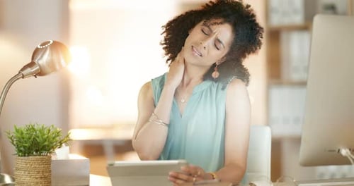 Neck pain, woman and stress in office at night for joint injury, muscle strain and poor posture