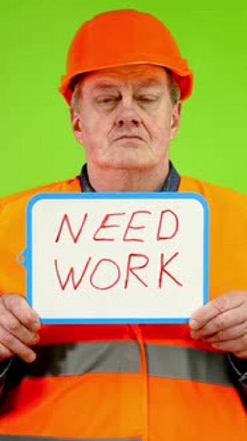 Construction Worker Holding Need Work Sign