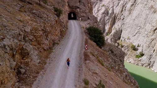 Woman Runner on Rocky Route