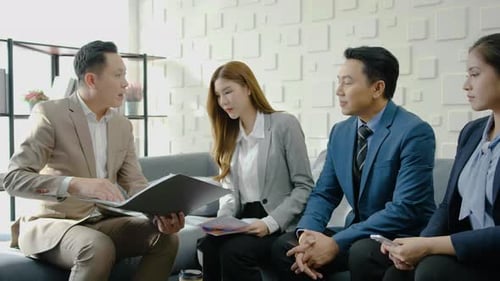 Diverse Team Having Meeting in Modern Workplace