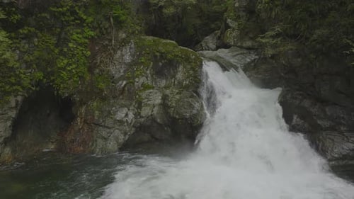 Pulling away from the waterfall as it pools in Lynn Canyon Vancouver