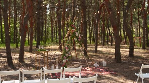Beautiful Bohemian Tipi Arch Decoration on Outdoor Wedding Ceremony Venue in Pine Forest with Cones
