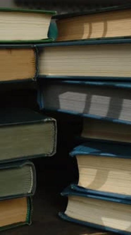 Vertical Video Bunch of Old Books Education Concept
