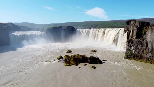 Epic Gooafoss Waterfall Cascading Through Ancient Icelandic Volcanic Basalt Rock Cliffs