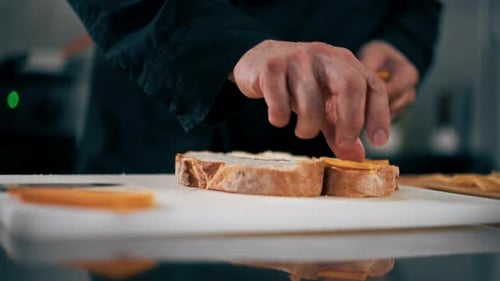 Closeup in Professional Kitchen Chef Folding Cheese Bruschettas Restaurant Serving
