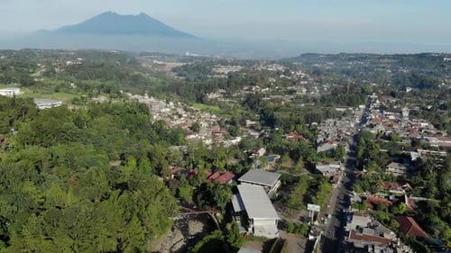 Aerial view of beautiful rural area mountain valley in Indonesia, nature video.