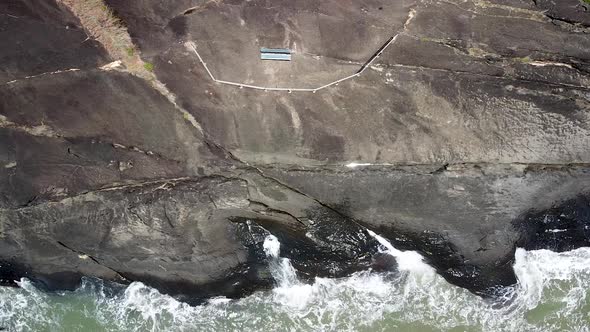 Aerial Of Waves Crashing Onto Rocks At Trinity Beach In Cairns. Static ...