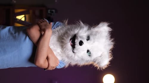 Person Wearing a Furry Animal Mask Indoors