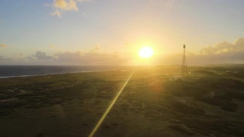 Aerial view of California Lighthouse along the coastline in Aruba.