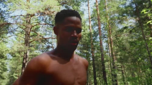 African American Athletic Man Running in the Park