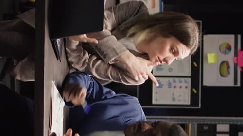 Professionals Discussing Documents in Bright Modern Office