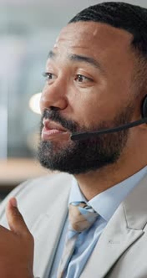 Businessman, call center and face consulting with headphones in customer service