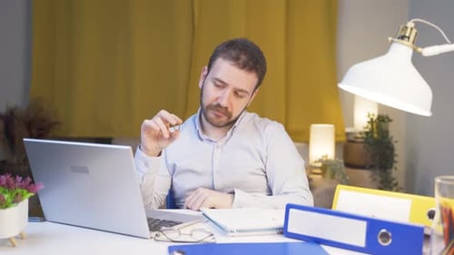 Home office worker man thinking about private life problems.