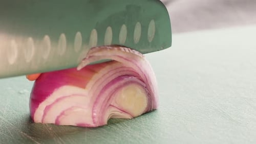 Chef Chopping a Red Onion with a Knife on the Cutting Board Macro Close Up of Cutting Red Onion on