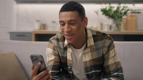 Smiling Man Talking on Smartphone Video Call