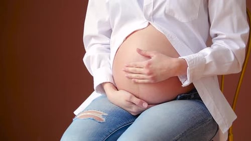 Pregnant Woman Caressing Tummy, Motherhood and Connection