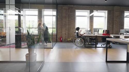 Diverse Adults Working in Modern Urban Office