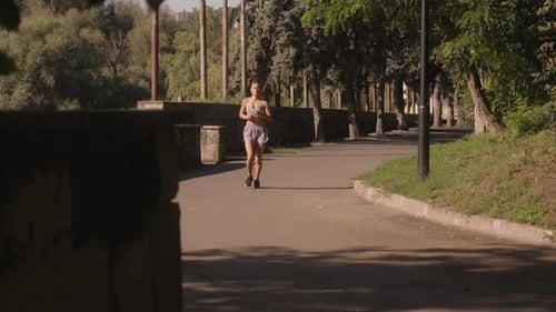 Woman Jogging In The Park