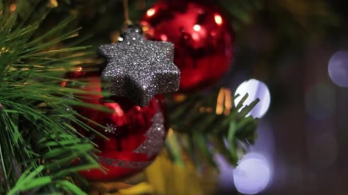 Christmas Tree Decorations Baubles and Star Close-up