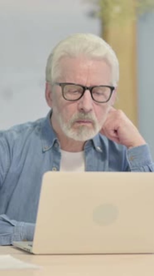 Pensive Old Man Thinking New Idea in Office, vertical video