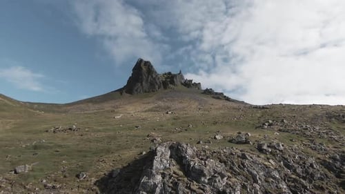 Flying towards sharp spectacular mountain peak in summer, Iceland