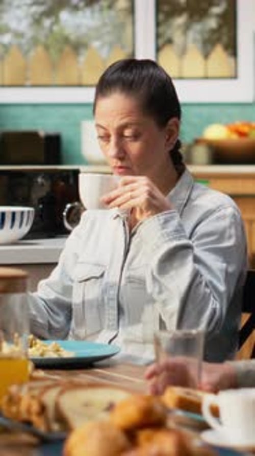 Vertical Video Preoccupied Mother Being Detached and Ignoring Her Family at the Table
